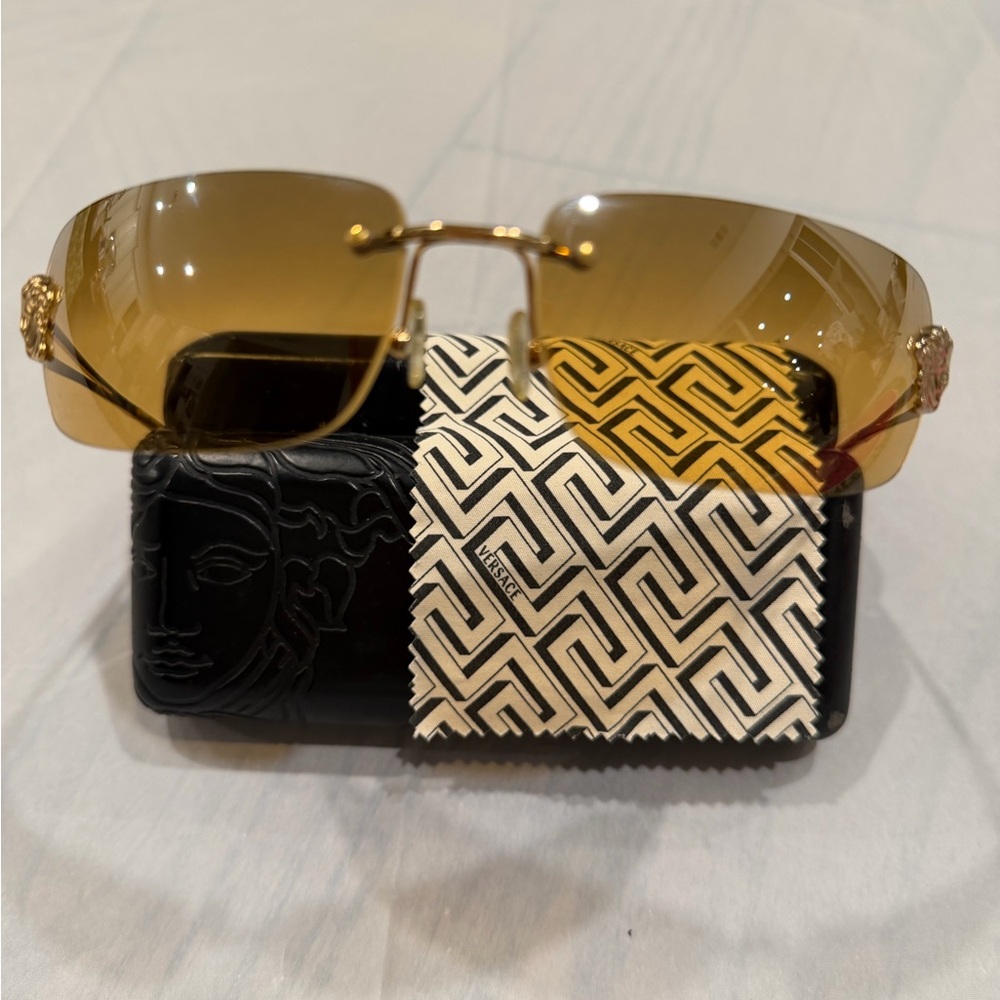 Versace Gold Rimless Sunglasses with Amber Lenses and Medusa Temples